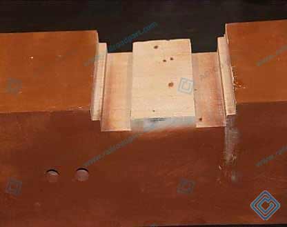 Machined groove and hole details on a GFU composite sleeper