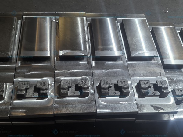 Batch of slide baseplates with finished metal working surfaces