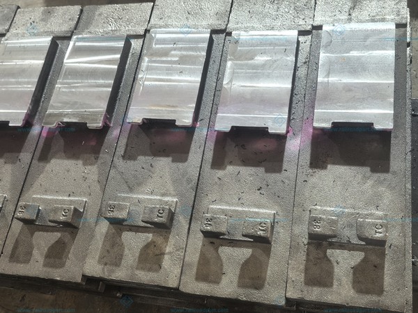 Slide baseplates showing machined switch-rail sliding surfaces