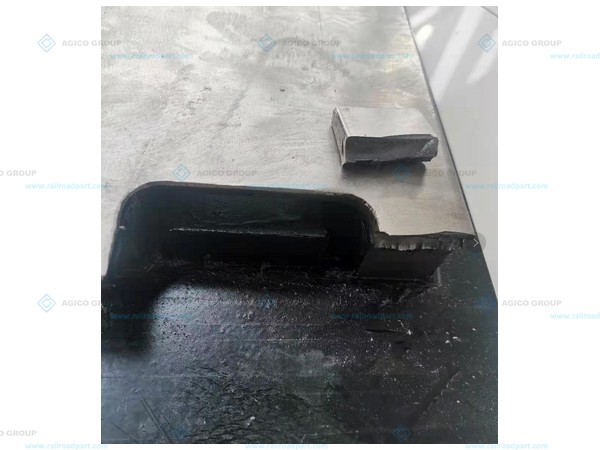 Fractured stock-rail hold-down projection on an existing slide chair