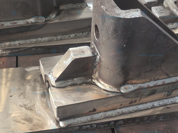 Fabrication detail showing welded rail-support components on plates